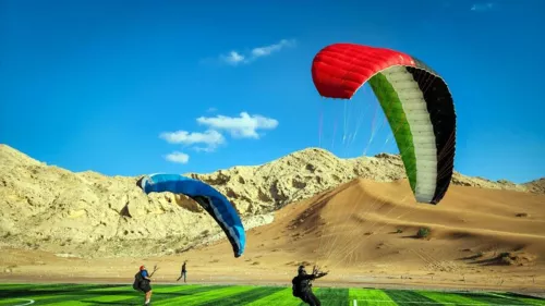 Sky Adventures in Sharjah; a unique paragliding experience against the backdrop of the rugged Hajar Mountains