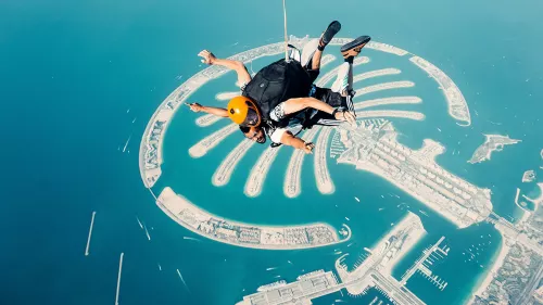 Skydive Dubai athletes achieve a first-ever wingsuit flight through the 301-meter-tall Address Beach Resort